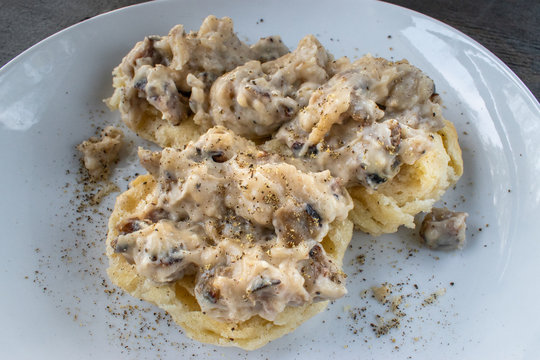 Homemade Biscuits And Sausage Gravy On Plate