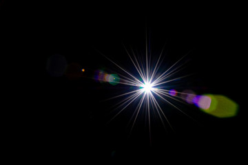 Lense flare sunlight ray. Sun shine flash effect or star spot glow light on black background. Gleams rounded and hexagonal shapes, rainbow halo.