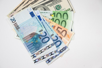 Obraz na płótnie Canvas Dollar and euro banknotes isolated on white background
