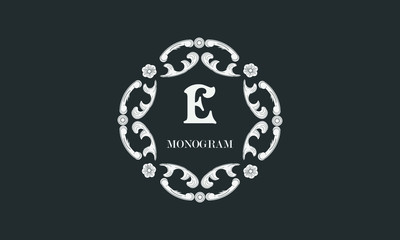 Vintage flower monogram with the letter E. Exquisite three-dimensional logo. Luxury frame for business sign, label, boutique brand, hotel, restaurant, heraldry.