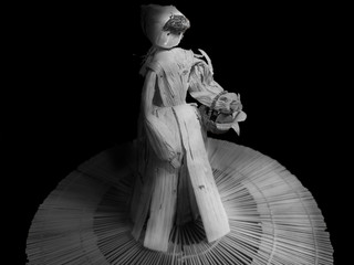 Woman made with recycled corn husks, with an old peasant look in black and white