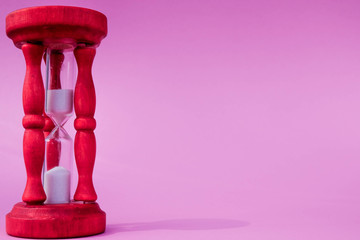 Bright Red Egg Timer Against A Pink Background Measuring Time