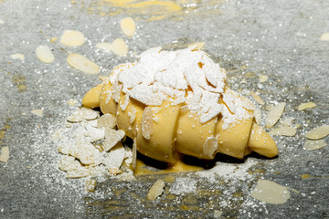 croissant with flour and almonds before cooking