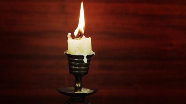 Lit candle with melted wax - Stock Image - C036/0272 - Science Photo Library