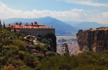 Fototapeta na wymiar Landscape in Meteora. Greece. View of the Monastery of Saint Stephen, in the rear the city of Kalambaka and Balcans mountain chain.