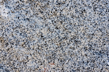 The texture of light pink natural granite with black spots