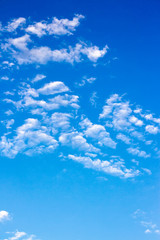 Fototapeta na wymiar bright fluffy clouds on the blue sky. wonderful nature background in summertime