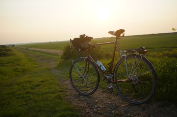 Naklejka na ściany i meble Racing bike and sunset