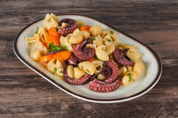 Pasta with octopus and yellow tomatoes