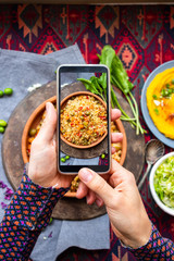 Phone food photo. Make overhead smartphone photography of bulgur with vegetables. Create vegan blog content.