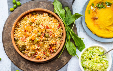 Bulgur pilaf or pulao - grain African, Levantine porridge with color vegetables. Vegan healthy food