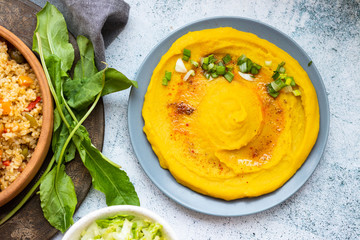 Chickpea creamy hummus spread with paprika, oil and greens. Vegan food