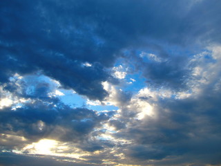Fototapeta premium Dark clouds, illuminated by the sun.