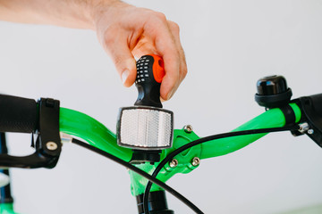 Installation of a front reflective green fix bike with white tires