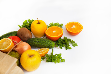 Set of food products on a white background. A paper bag delivers a quarantine food crisis. Food Delivery, Donation, Coronavirus. Fresh vegetables, fruits. Soft focus.