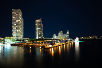 Fototapeta na wymiar Miami Beach with next to the city line. Miami, Florida, Miami Beach city skyline with night sky.
