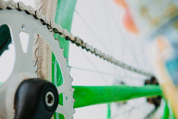 grease spray chain white green fix bike. Close-up.