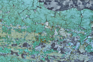 Background.The texture of the old paint is turquoise and green on the iron surface, the paint comes off.