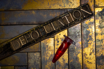 Photo of real authentic typeset letters forming Depopulation text with red fluid filled laboratory...
