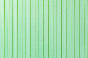 Texture. Polycarbonate sheet. Plastic. Green color. Vertical stripes