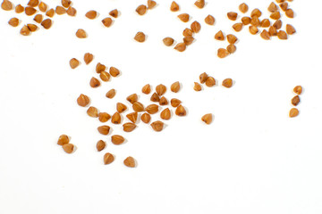 heap of buckwheat groats closeup with a place for inscription