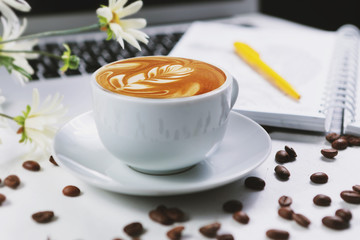 .Cappuccino on a white background. White vintage background. Menu background. Sweet food. Vintage coffee background. White background, isolated. Hot drink. Remote work