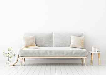 Interior wall mockup with gray velvet sofa, beige pillows and plaid, branch in vase and coffee table in living room with empty white wall background. 3D rendering, illustration.