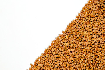 peeled buckwheat grain closeup with place for an inscription