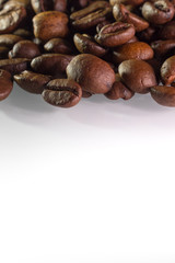 coffee beans on the top isolated on white background with shadows