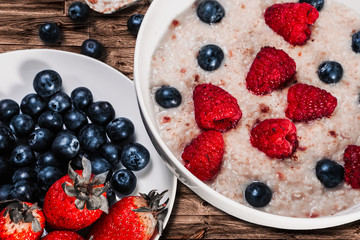 Oatmeal with berries. Vegetarian healthy food. Healthy fresh nutrition.