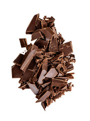 Falling Chocolate pieces and  shavings  isolated on white background.