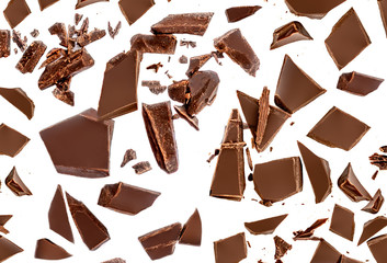 Chocolate pieces Pattern. Chocolate chunks   isolated on white background. Flat lay.