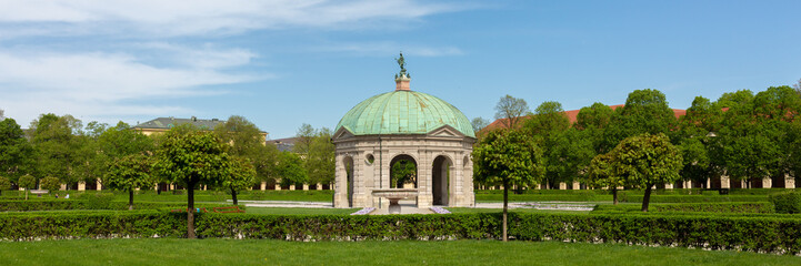 Fototapeta premium Panorama of Hofgarten with Dianatempel (temple of Diana) during springtime.