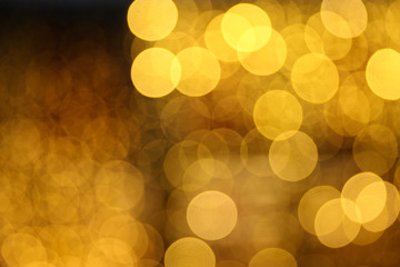 blurred golden circles of lights. defocused lights of festive garland