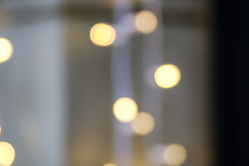 blurred golden circles of lights. defocused lights of festive garland