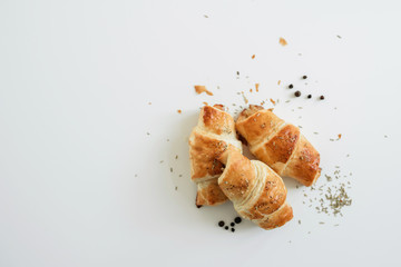 Homemade puff on the white table. Croissant with cheese and meat - 345998361