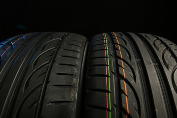 beautiful summer tire tread close up on black background. tread of tyre close up with copy space