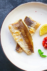 Fried fish fillet hake, seafood main course pescatarian Menu concept. food background. top view copy space for text keto or paleo diet