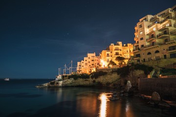 Fototapeta na wymiar Night photo of Saint Paul's Bay Xemxija Malta 