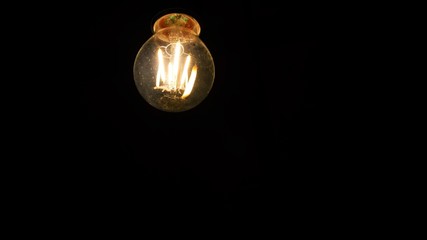 filament type bulb in black background