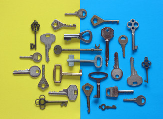 various metal keys on a blue-yellow background