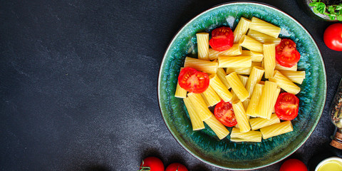 pasta tomatoes ready to eat healthy food Tortiglioni and tomato sauce (Italian main course Maccheroni, Rigatoni) menu concept. food background. top view. copy space for text