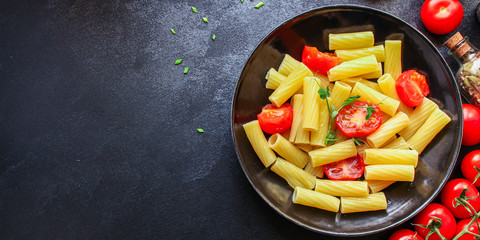 pasta tomatoes ready to eat healthy food Tortiglioni and tomato sauce (Italian main course Maccheroni, Rigatoni) menu concept. food background. top view. copy space for text