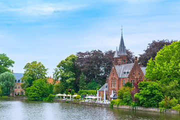 Fototapeta na wymiar Bruges, Belgium. Kasteel de la Faille on the shore of the lake of love.