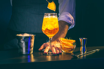 Bartender preparing Aperol Spritz cocktail