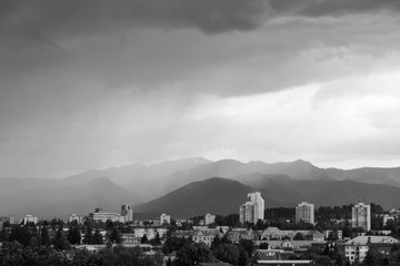 Sunrise and sunset, beautiful clouds over the meadow, hills and buildings in the town. Slovakia