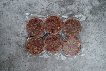 Blast chilled beef patties in a vacuum packing, ready-to-cook meat patties