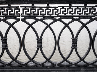 Cast iron wrought iron railings fencing on the embankment.