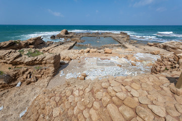 The ruins of palace of Herod the Great with basin and mosaic in roman Caesarea Maritima, Israel 