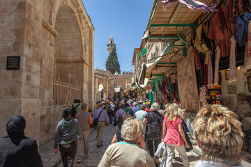 Fototapeta premium Pilgrims on the Via Dolorosa in Jerusalem, Israel